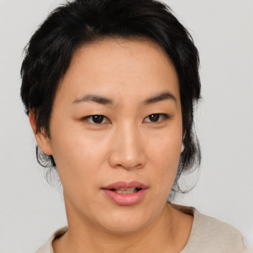Neutral asian young-adult female with medium  black hair and brown eyes