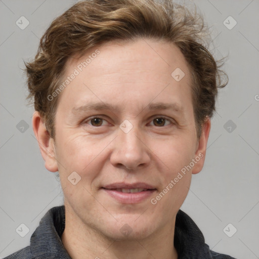 Joyful white adult male with short  brown hair and grey eyes