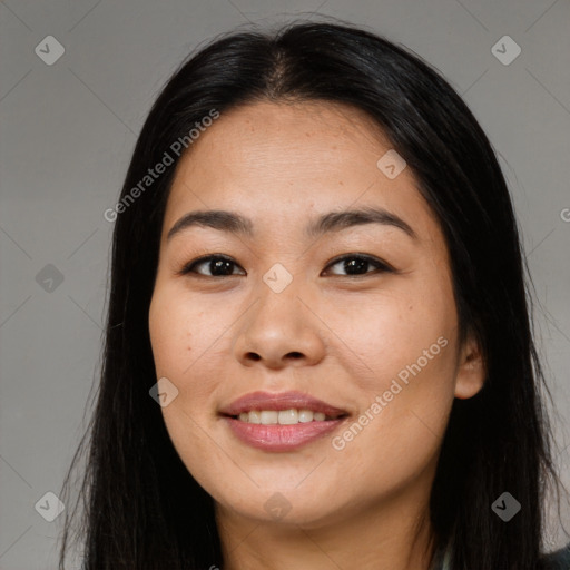 Joyful asian young-adult female with long  black hair and brown eyes