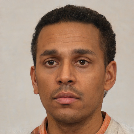 Neutral latino adult male with short  black hair and brown eyes