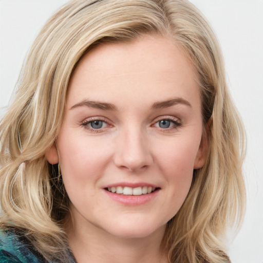 Joyful white young-adult female with medium  brown hair and blue eyes