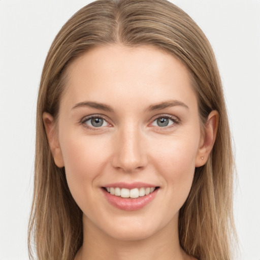 Joyful white young-adult female with long  brown hair and grey eyes