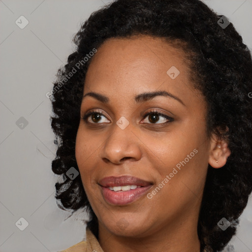 Joyful black young-adult female with medium  black hair and brown eyes