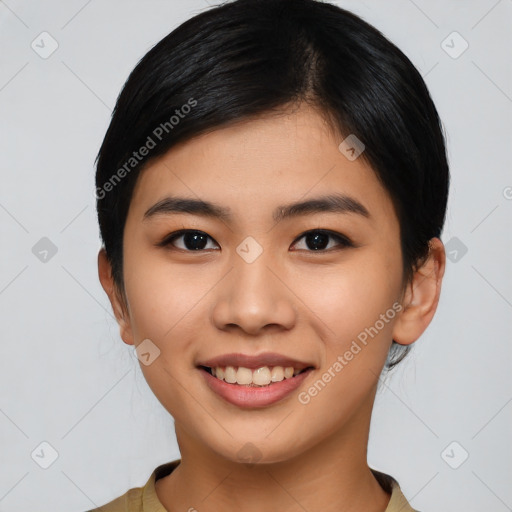 Joyful asian young-adult female with short  black hair and brown eyes