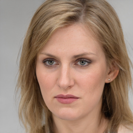 Joyful white young-adult female with medium  brown hair and blue eyes