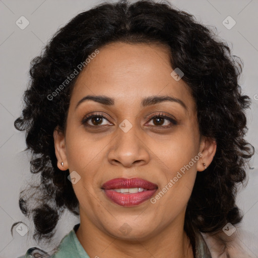 Joyful black adult female with medium  brown hair and brown eyes