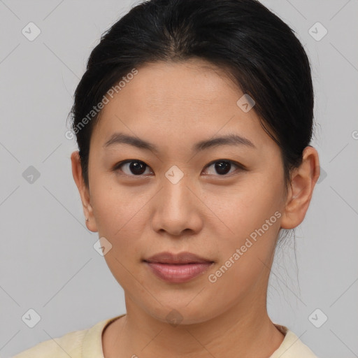 Joyful asian young-adult female with short  brown hair and brown eyes