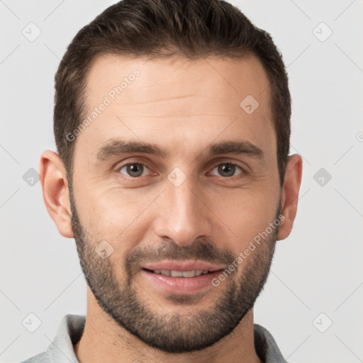 Joyful white young-adult male with short  brown hair and brown eyes