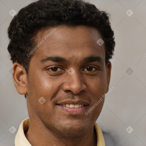 Joyful black young-adult male with short  brown hair and brown eyes