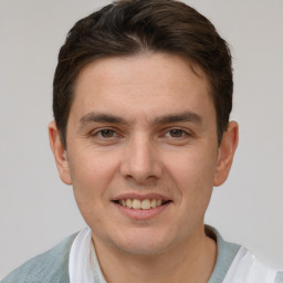 Joyful white young-adult male with short  brown hair and brown eyes