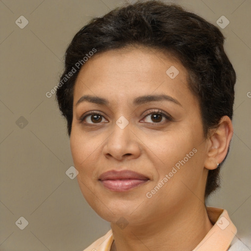 Joyful latino adult female with short  brown hair and brown eyes