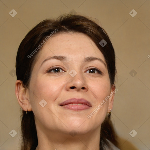 Joyful white adult female with medium  brown hair and brown eyes