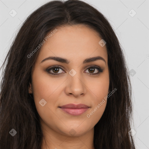 Joyful latino young-adult female with long  brown hair and brown eyes