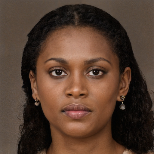 Neutral black young-adult female with long  black hair and brown eyes