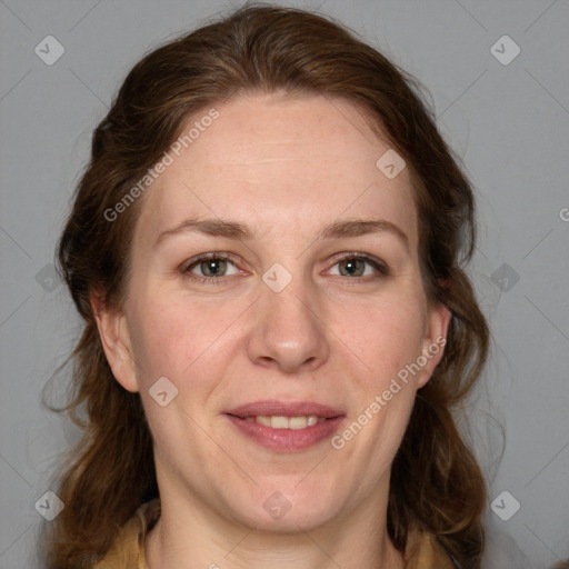 Joyful white adult female with medium  brown hair and grey eyes