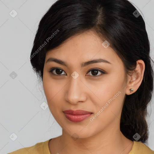 Joyful latino young-adult female with long  brown hair and brown eyes