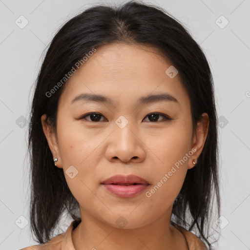 Joyful asian young-adult female with medium  brown hair and brown eyes