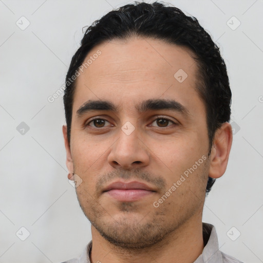 Neutral latino young-adult male with short  black hair and brown eyes