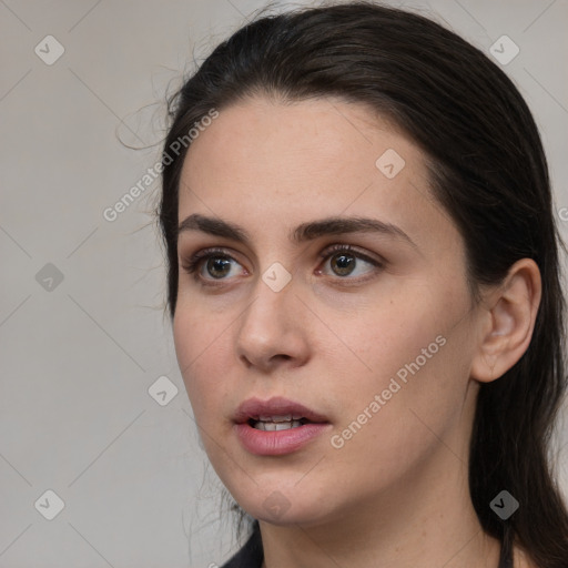 Neutral white young-adult female with long  brown hair and brown eyes