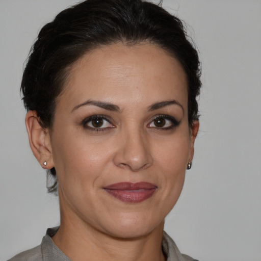 Joyful white adult female with short  brown hair and brown eyes