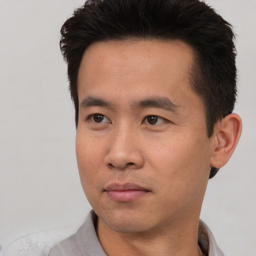 Neutral asian young-adult male with short  black hair and brown eyes