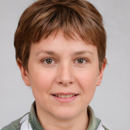 Joyful white young-adult female with short  brown hair and grey eyes