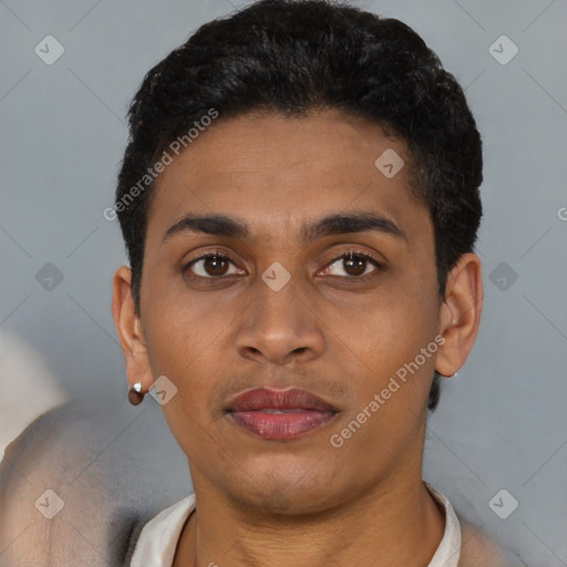 Joyful latino young-adult male with short  brown hair and brown eyes