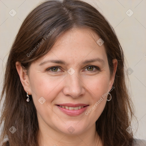 Joyful white adult female with long  brown hair and brown eyes