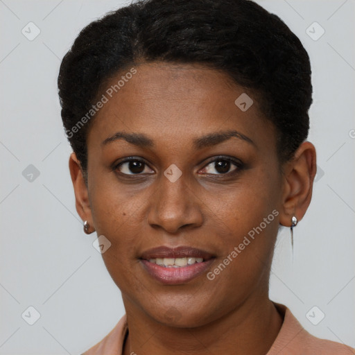 Joyful black young-adult female with short  brown hair and brown eyes