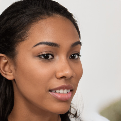 Joyful latino young-adult female with long  brown hair and brown eyes