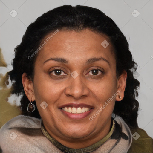 Joyful black adult female with medium  brown hair and brown eyes