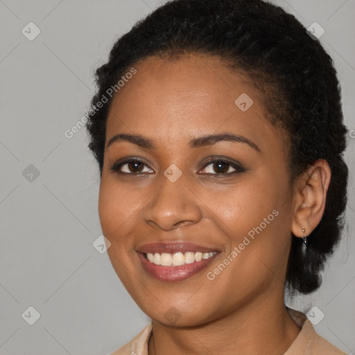 Joyful black young-adult female with medium  brown hair and brown eyes