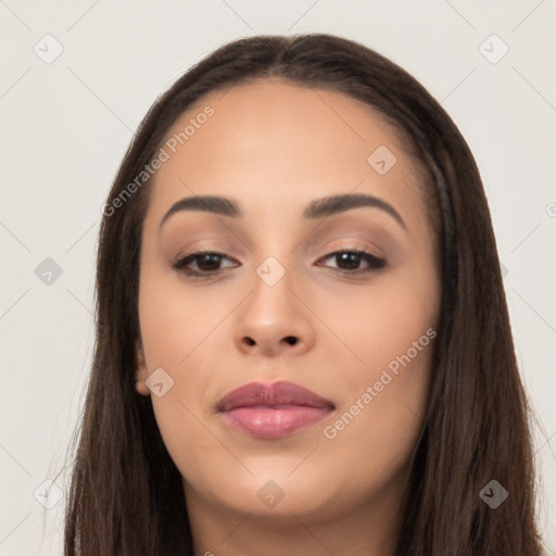 Joyful latino young-adult female with long  brown hair and brown eyes