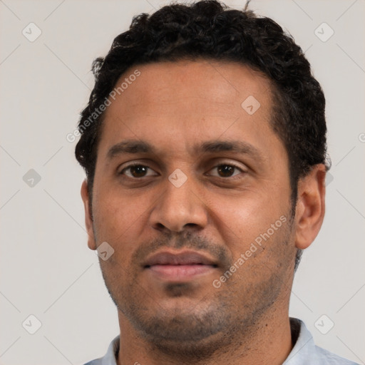 Neutral white adult male with short  black hair and brown eyes