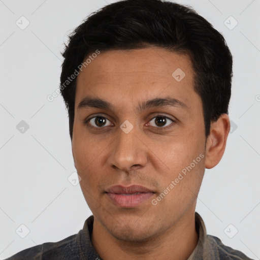 Joyful latino adult male with short  black hair and brown eyes