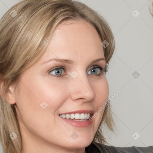 Joyful white young-adult female with medium  brown hair and blue eyes