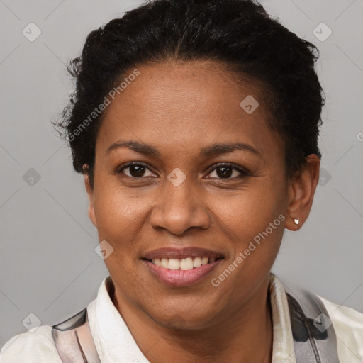 Joyful black adult female with short  brown hair and brown eyes