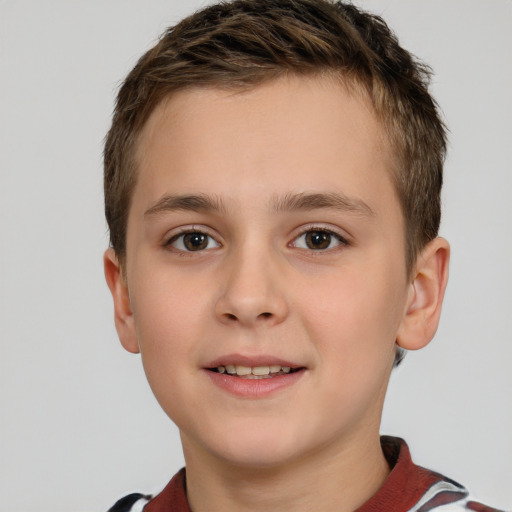 Joyful white child male with short  brown hair and brown eyes