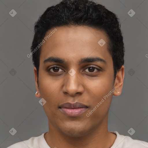 Joyful black young-adult male with short  black hair and brown eyes