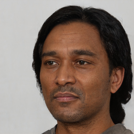 Neutral latino adult male with short  black hair and brown eyes