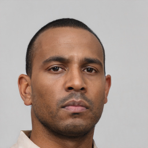 Neutral black young-adult male with short  black hair and brown eyes