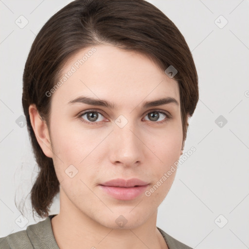 Neutral white young-adult female with medium  brown hair and brown eyes