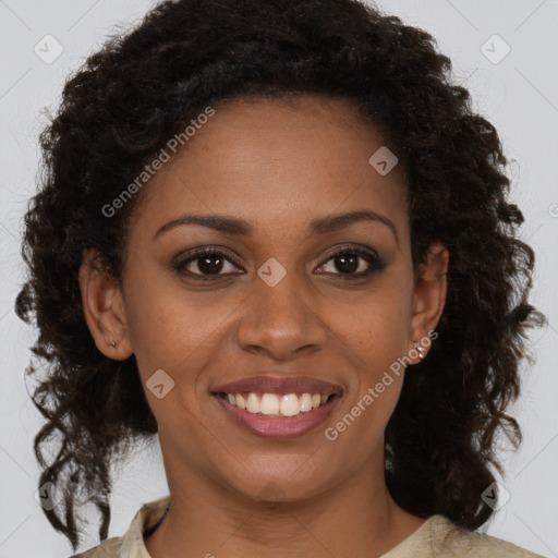 Joyful black young-adult female with medium  brown hair and brown eyes