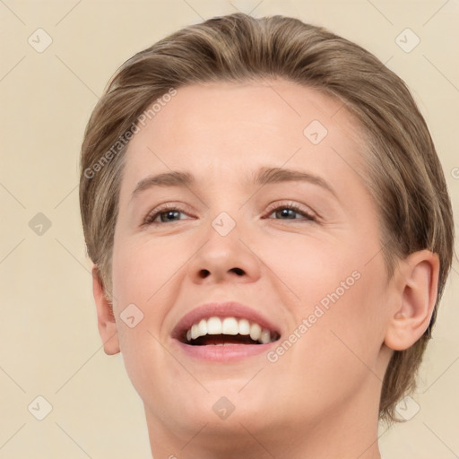 Joyful white young-adult female with medium  brown hair and brown eyes