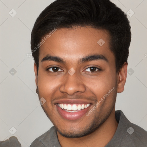 Joyful black young-adult male with short  brown hair and brown eyes