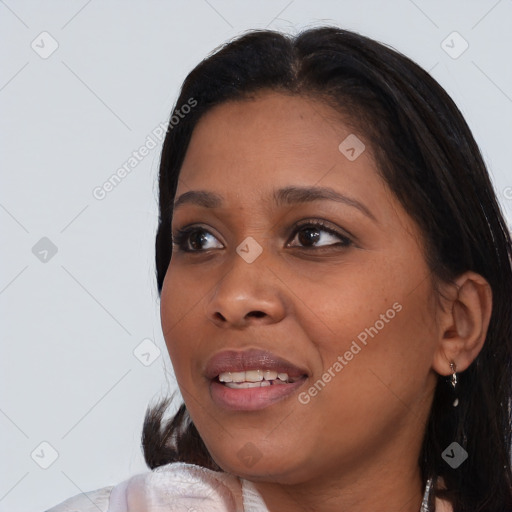 Joyful black young-adult female with medium  brown hair and brown eyes