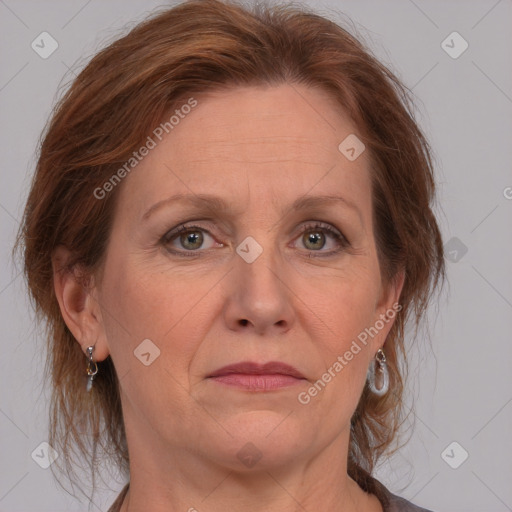 Joyful white adult female with medium  brown hair and grey eyes