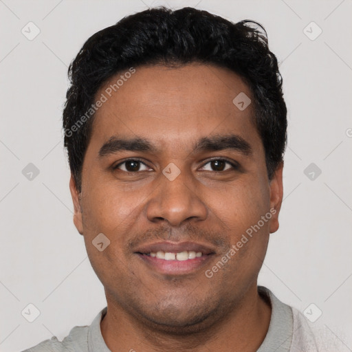 Joyful latino young-adult male with short  black hair and brown eyes