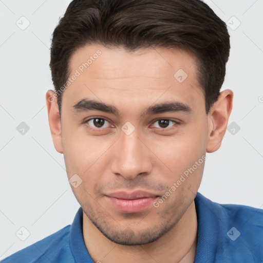 Joyful white young-adult male with short  brown hair and brown eyes