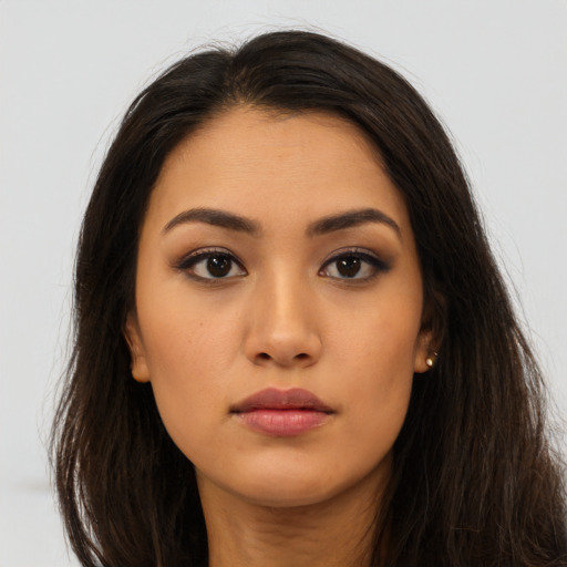 Neutral latino young-adult female with long  brown hair and brown eyes